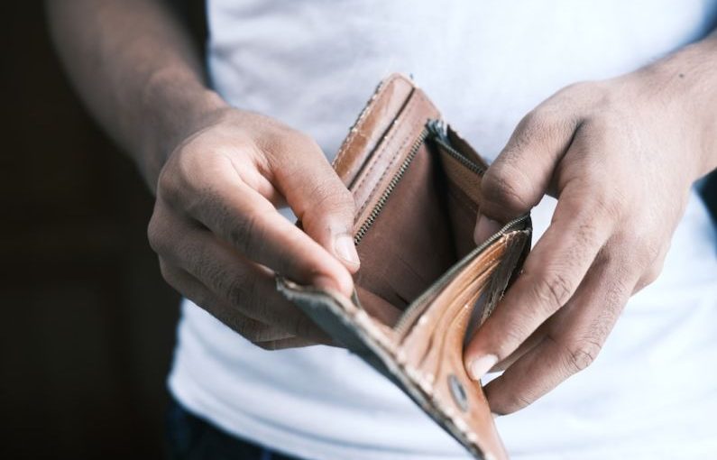 Cash Flow - person holding brown leather bifold wallet