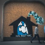 Rental Price Tag - man in gray long sleeve shirt standing beside brown wall