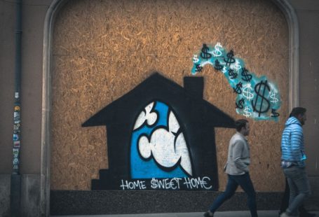 Rental Price Tag - man in gray long sleeve shirt standing beside brown wall