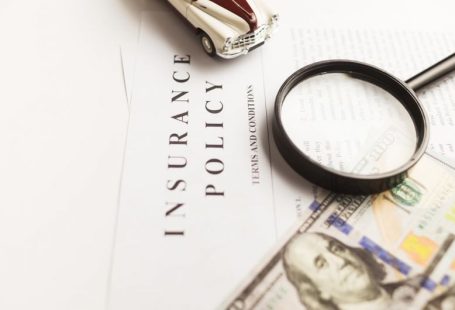 Insurance Policy - a magnifying glass sitting on top of a piece of paper