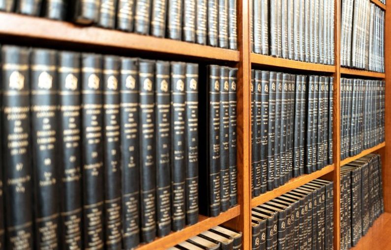 Law Books - black book on shelf