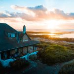Vacation Home - aerial photo of house near calm body of water