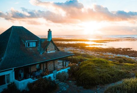 Vacation Home - aerial photo of house near calm body of water