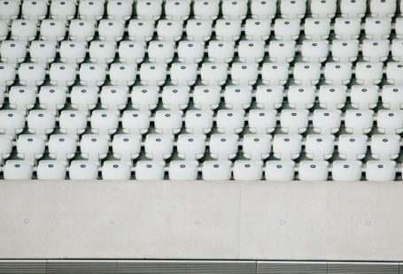 Multiple Properties - white seats with gray concrete platform