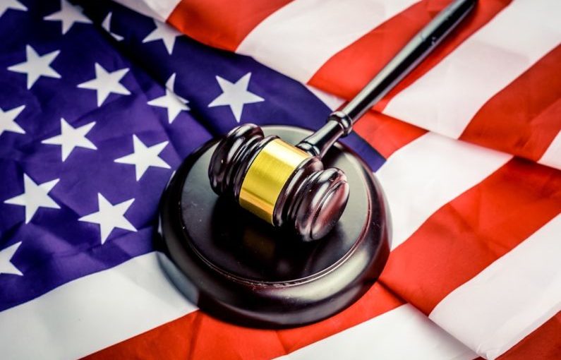 Auction Gavel - a judge's gavel on top of a flag