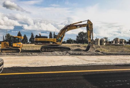 Construction Site - yellow Caterpillar excavator digging up dirt