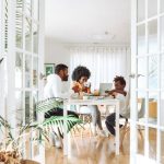 Family Home - people sitting on chairs in front of table