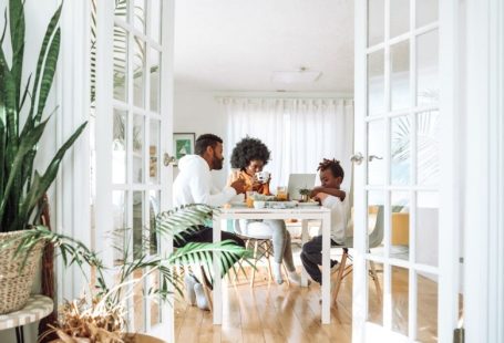 Family Home - people sitting on chairs in front of table
