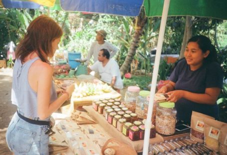 Buyer's Market - woman standing in front of stall