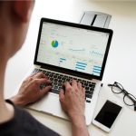 Market Graph - person using MacBook Pro