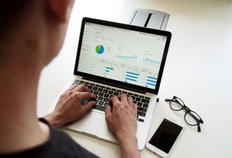 Market Graph - person using MacBook Pro