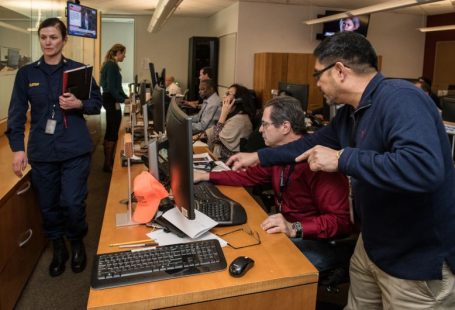 Portfolio Planning - man in blue jacket using computer