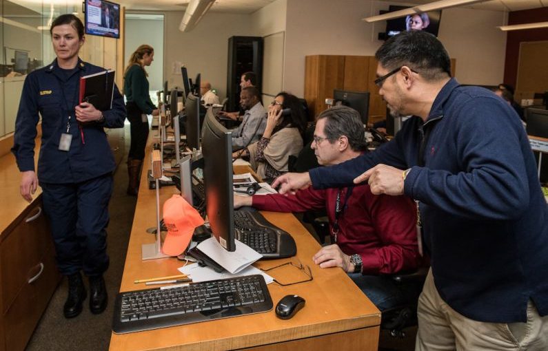 Portfolio Planning - man in blue jacket using computer