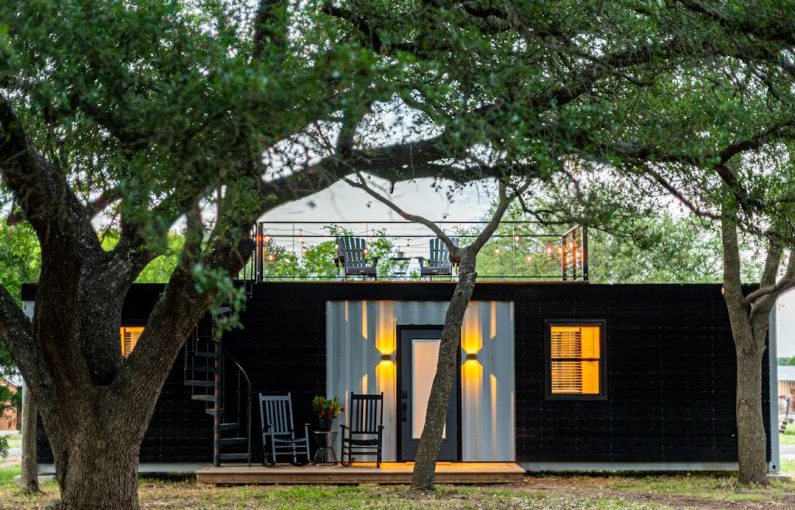 Tiny Home - brown wooden house near green tree during daytime