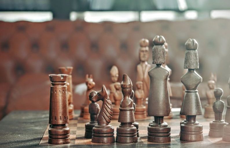 Risk Management - selective focus photography of chess pieces