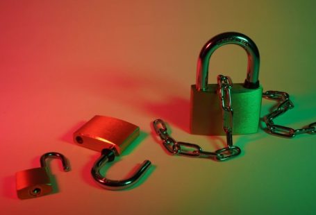 Cybersecurity Lock - pink padlock on silver chain
