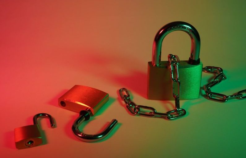 Cybersecurity Lock - pink padlock on silver chain